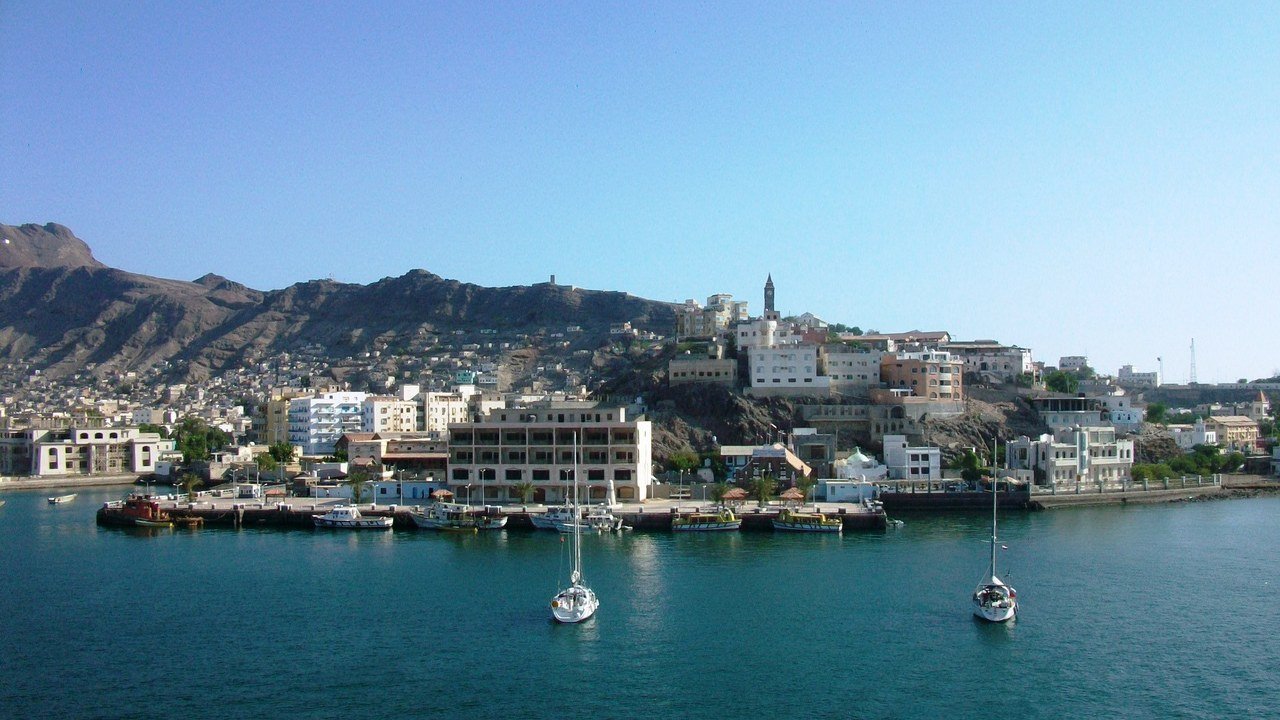Stand-in, not a photo of this event: 2010 view of the Port of Aden in Yemen, with cargo ships, cranes and industrial buildings along the harbour