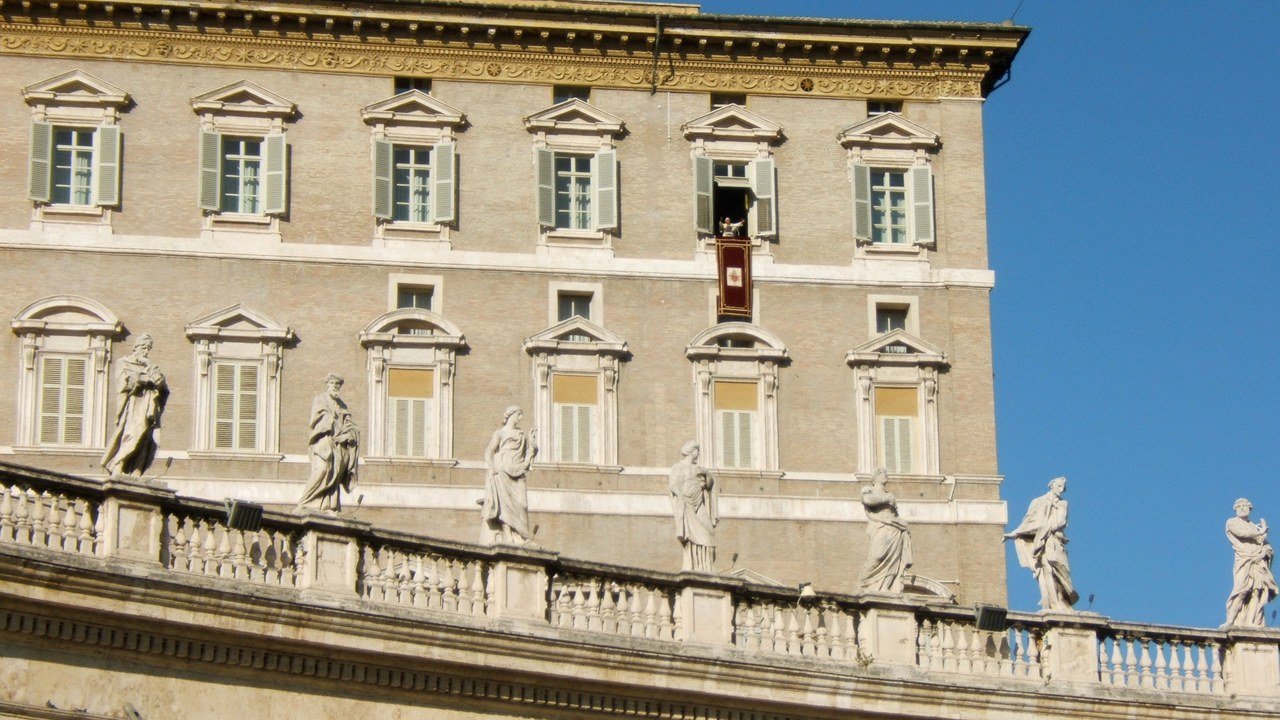 Stand-in, not a photo of this event: December 2008 file photo of the Apostolic Palace papal window overlooking St. Peter's Square in Vatican City, with the facade and window frames in daylight
