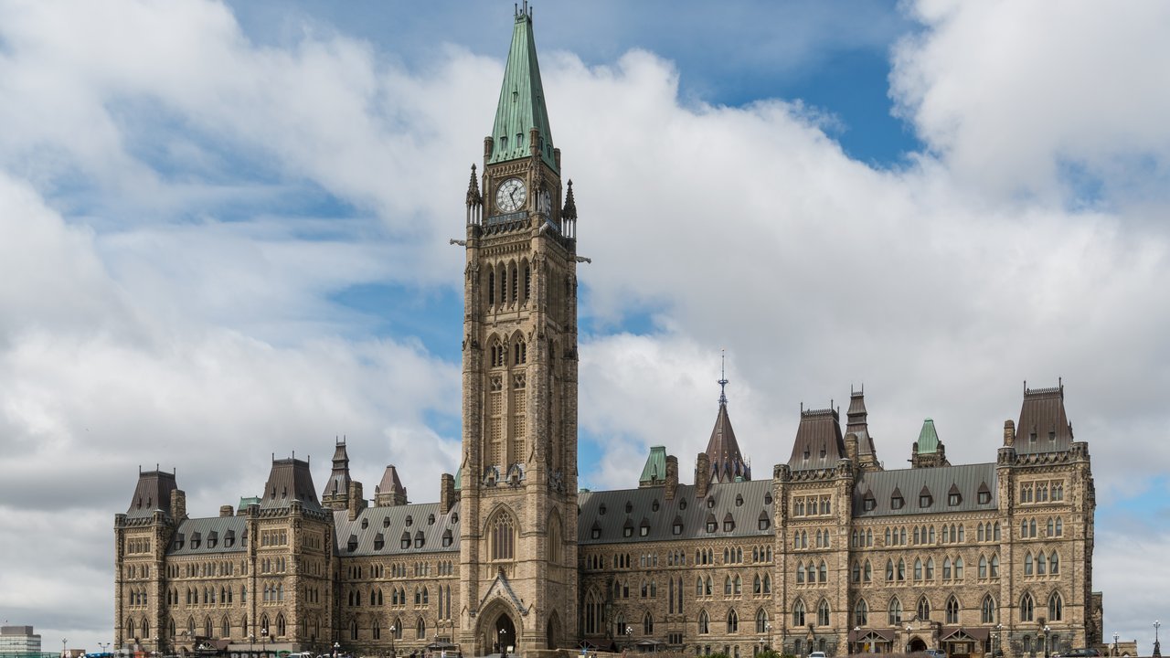 Stand-in, not a photo of this event: an April 2017 file photo of the Centre Block and Peace Tower on Parliament Hill in Ottawa under a cloudy sky