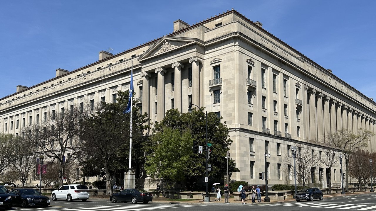 Stand-in: the Robert F. Kennedy Department of Justice Building in Washington, a large neoclassical stone building with columns, in March 2026