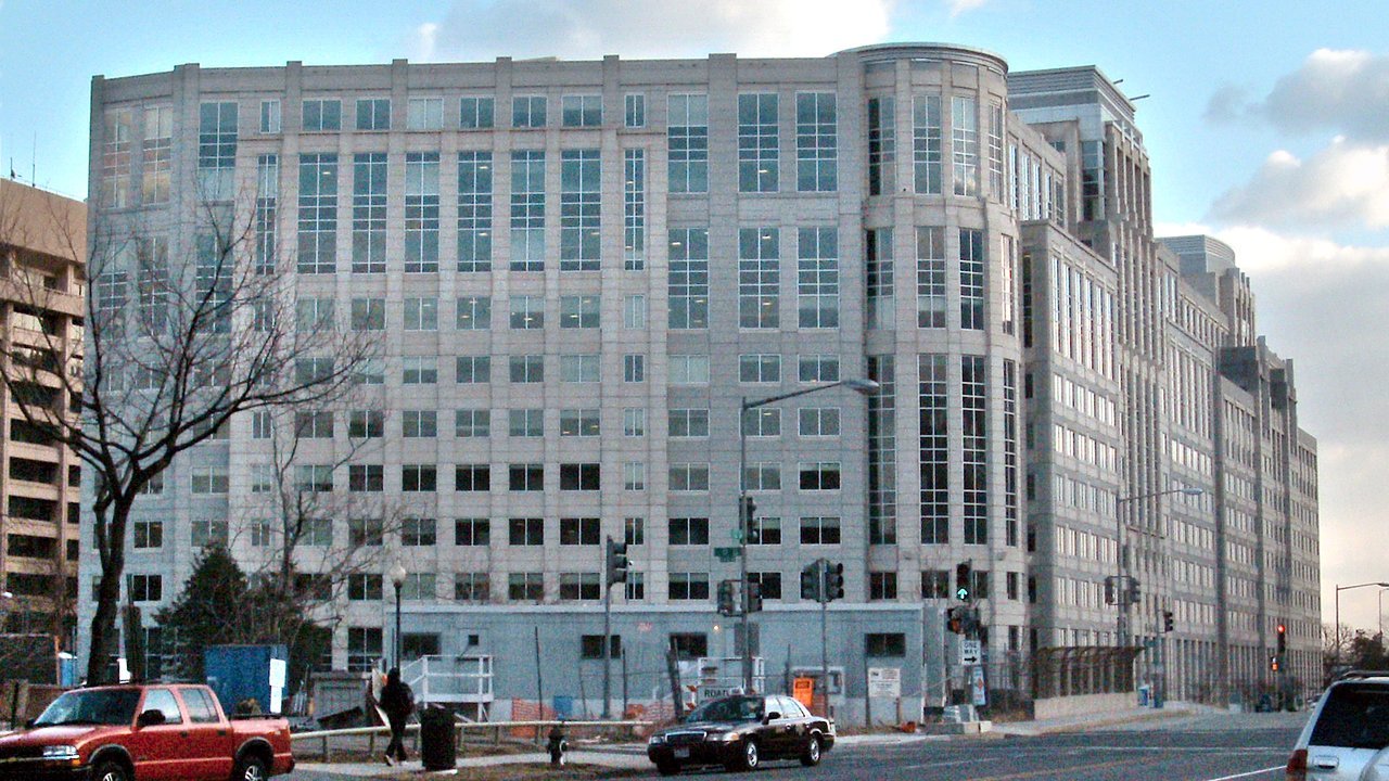 Stand-in: the U.S. Immigration and Customs Enforcement headquarters, a pale multi-story office building on a Washington street, in 2009