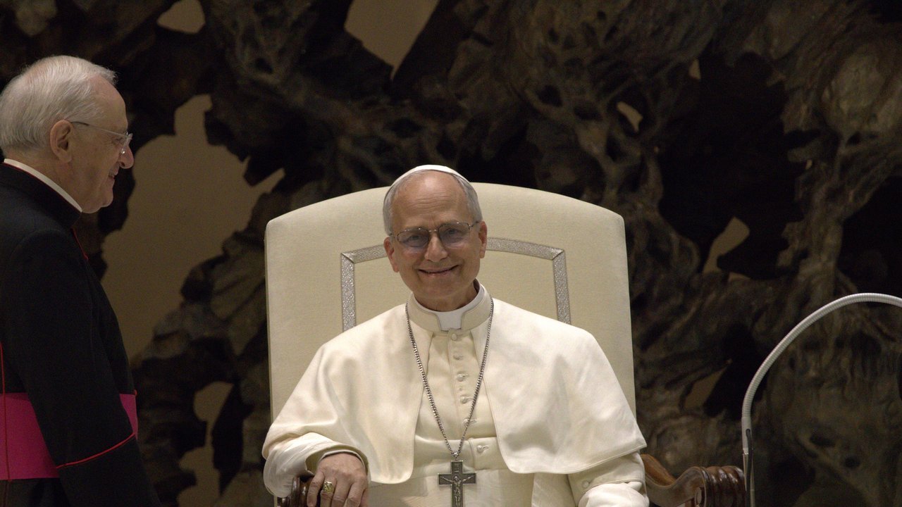 File photo, not from this week: Pope Leo XIV, in white, smiles from a cream chair during an audience with the media on May 12, 2025