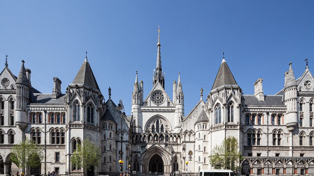 Stand-in, not a photo of this case: the Gothic stone main gate of the Royal Courts of Justice on the Strand in London, April 2019