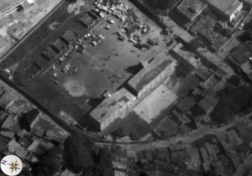 Aerial view of Haitian earthquake victims on soccer field from Global Hawk 2010-01-14 — free Wikimedia Commons media