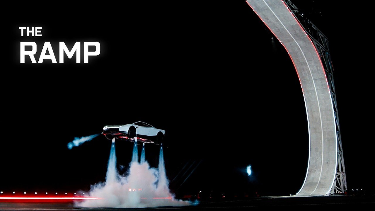 The white new-generation Tesla Roadster hovering in midair on downward thruster jets above a cloud of exhaust, at night beside a tall curved ramp, in a still from Tesla's official Roadster demo video