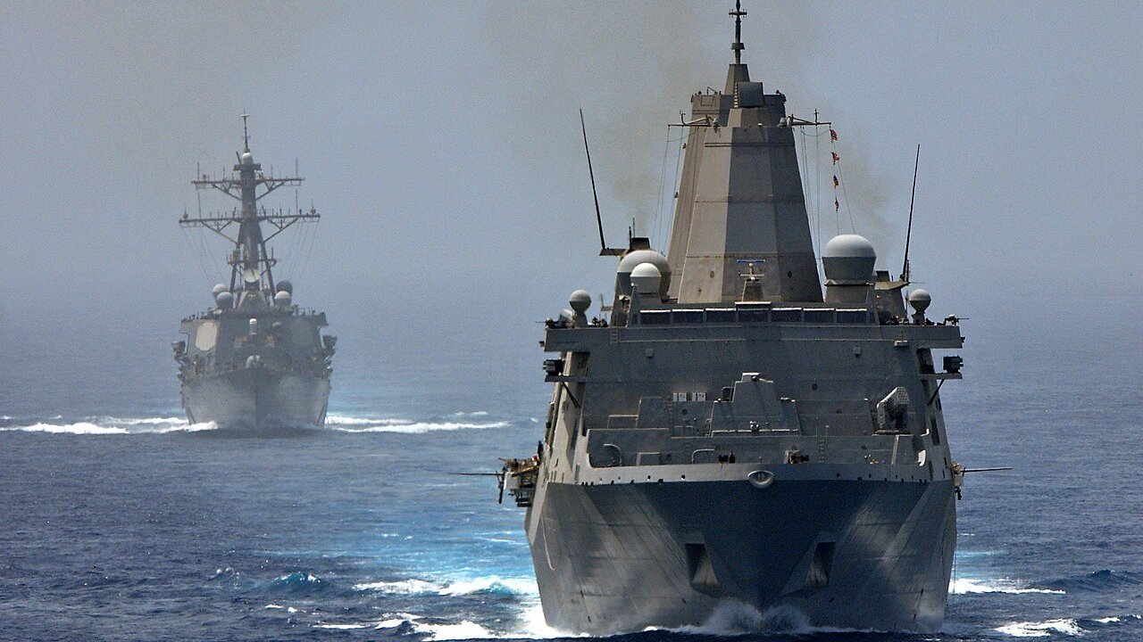 Stand-in: June 2012 U.S. Navy photo of USS New York and USS Porter in the Strait of Hormuz, not a photo of the reported strikes